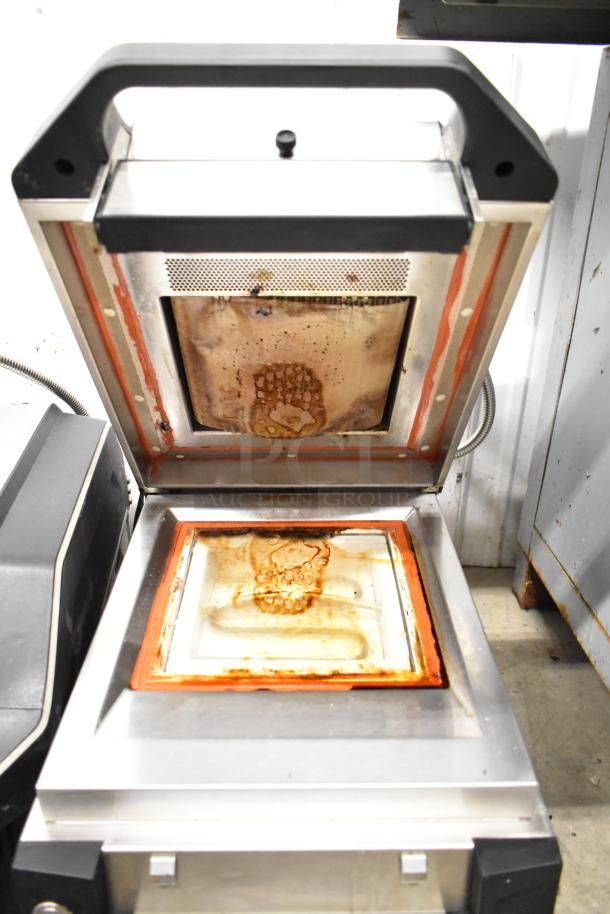 2019 Electrolux HSPP3BPRS Commercial Panini Press, visible wear, 208 Volts, 1 Phase. Open, metal top and bottom grill plates.