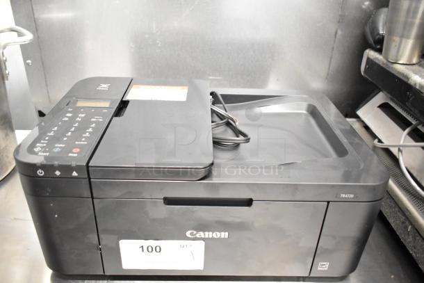 Canon K10546 Multifunction Printer, black, compact design, model TR4720, in good condition with visible control panel.