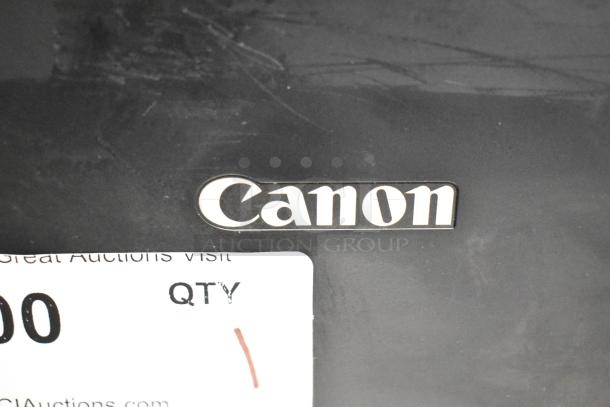 Canon K10546 Multifunction Printer, black finish. Visible Canon logo and auction label, indicating item number and quantity.
