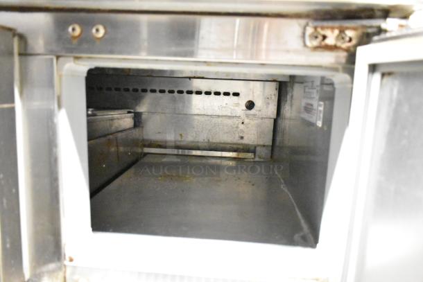 2017 Continental CPA68 pizza prep table interior view, stainless steel, 2 drawers, 2 doors, 115V, commercial use.