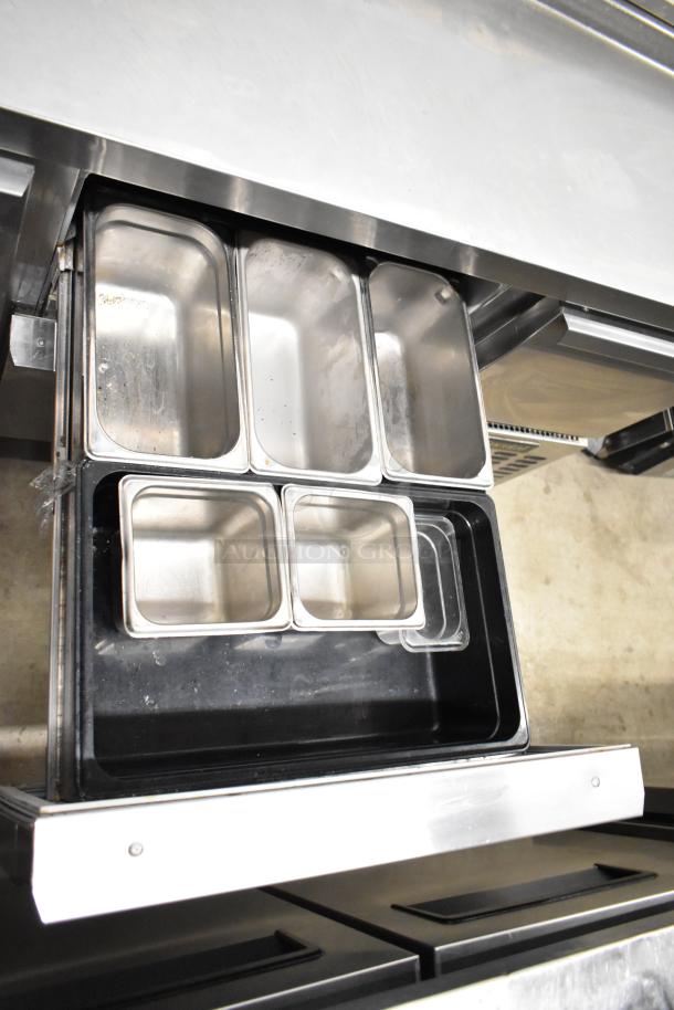 2017 Continental CPA68 pizza prep table with 2 drawers, 2 doors, stainless steel, 115V, 1 phase. Includes ingredient pans.