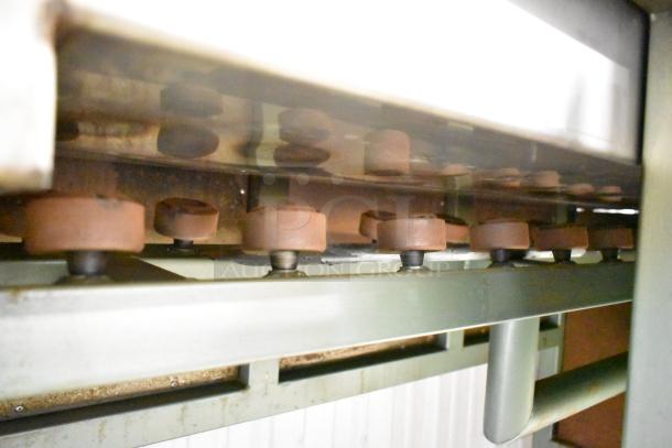 Lenin gas-powered chip fryer conveyor machine, 220,000 BTU, on commercial casters. Visible conveyor mechanism detail.