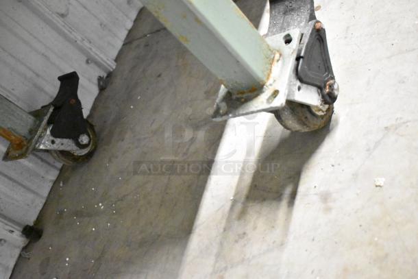 Lenin gas-powered chip fryer conveyor machine, 220,000 BTU, on heavy-duty commercial casters, visible wear.