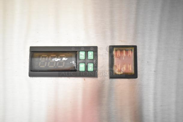 Close-up of Avantco 178A19FHC freezer control panel, showing digital display and buttons on stainless steel surface.