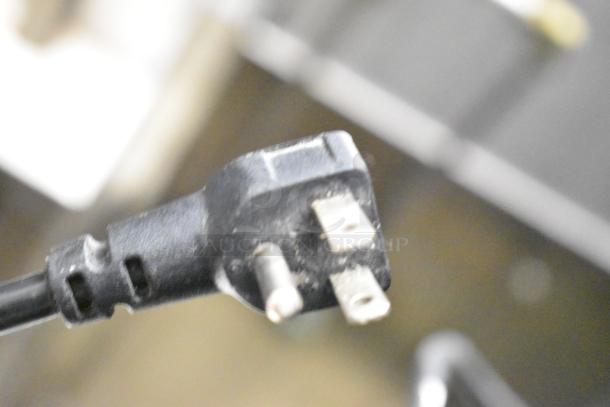 Close-up of a power plug for the Danby DWC036A1BSSDB-6 mini cooler merchandiser, 115 volts, 1 phase.