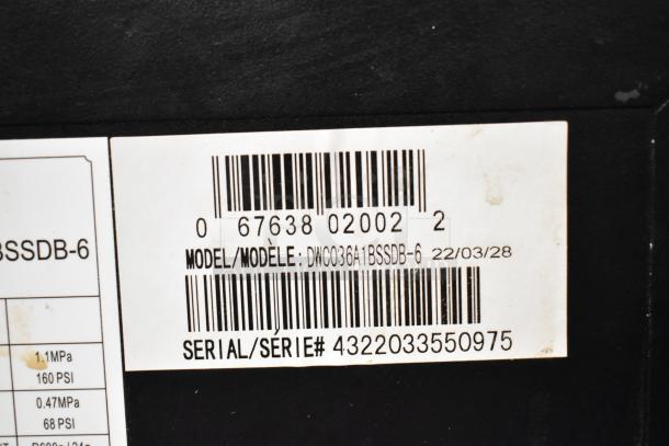 Barcode label on Danby DWC036A1BSSDB-6 Mini Cooler Merchandiser, showing model and serial numbers.