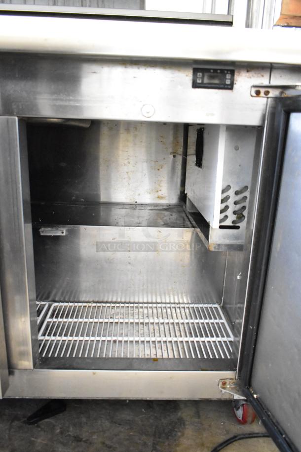 Cooltech CTR-48BMB sandwich prep table with 2-tier overshelf, commercial casters, visible interior shelving.