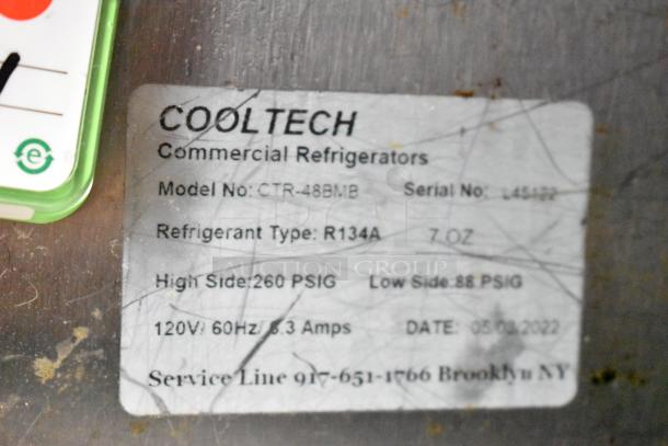 Cooltech CTR-48BMB label showing model, serial number, refrigerant type R134A, and voltage specifications. Scratches visible.