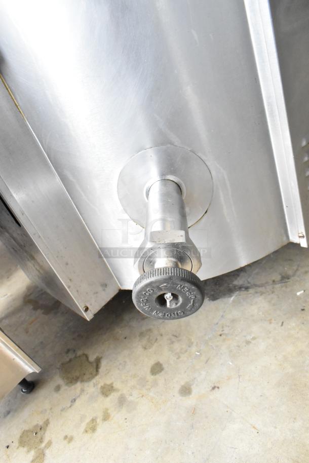 Groen EE-40 Commercial 40 Gallon Steam Kettle, stainless steel spout, durable design, floor style, used condition.