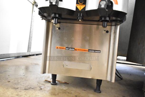 Bunn LCA-2 commercial coffee dispenser, stainless steel, 120 volts, 1-phase, with hot liquid warning label.