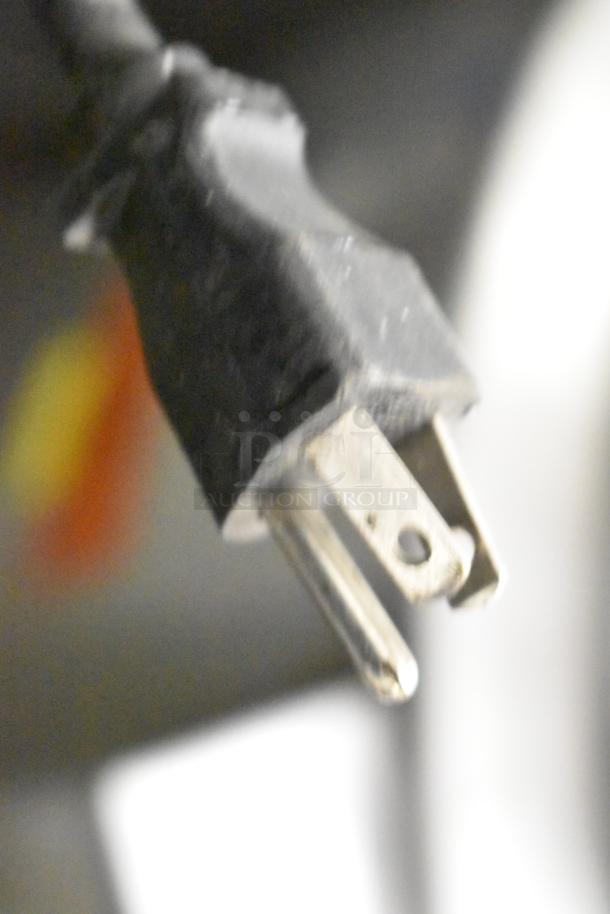 Close-up of a power cord plug for a Bunn LCA-2 Commercial Ambient Liquid Coffee Dispenser, 120 Volts, 1 Phase.
