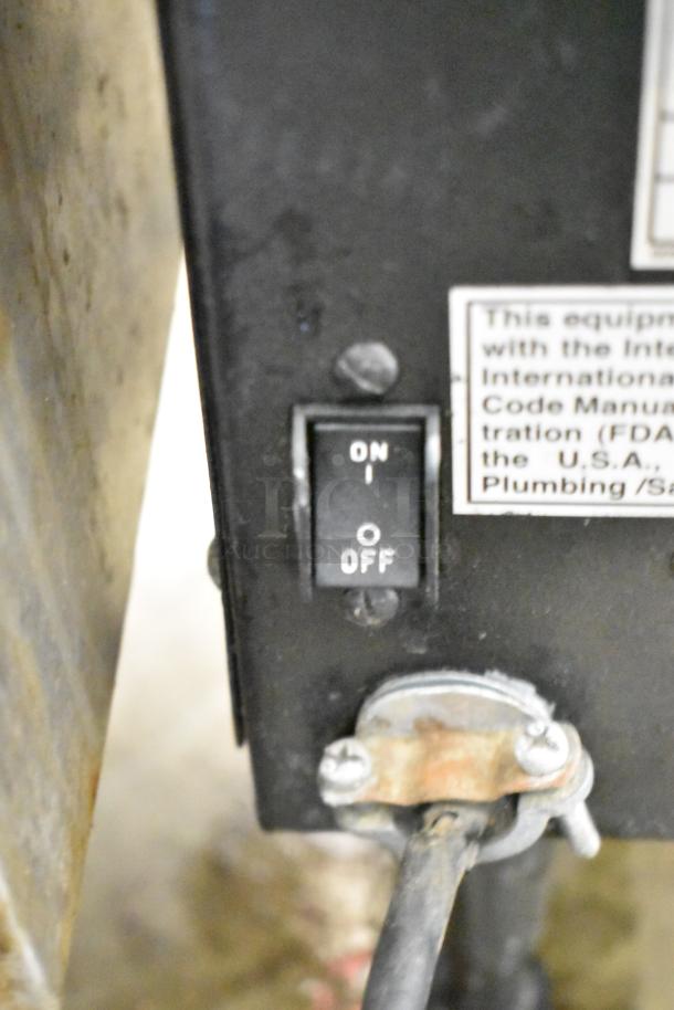 Bunn LCA-2 Commercial Liquid Coffee Dispenser switch close-up; features on/off toggle.