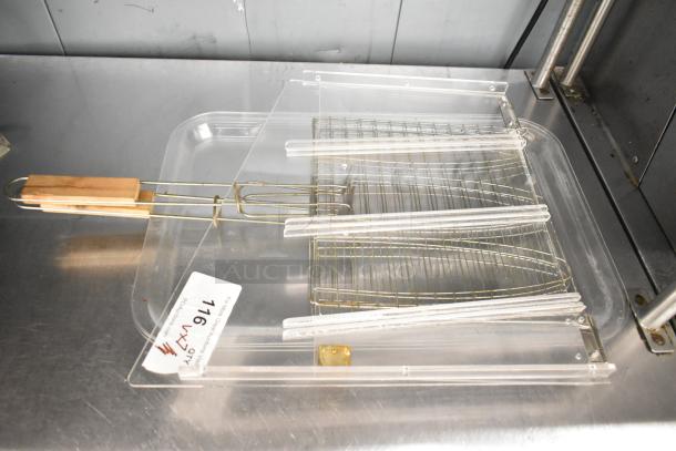 Seven assorted items including poly trays and wire racks, featuring wooden handles. Condition appears used. Label reads "716."