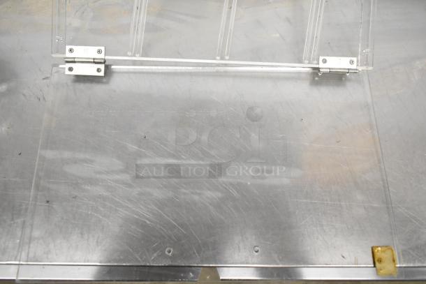 7 various poly trays and pieces, featuring clear acrylic construction with metal hinges. Items have visible surface wear.