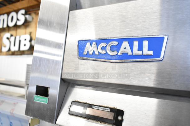 McCall 4-4045 Commercial 2 Door Reach In Cooler, 115 Volts, 1 Phase. Features McCall logo and Weiss Instruments gauge.