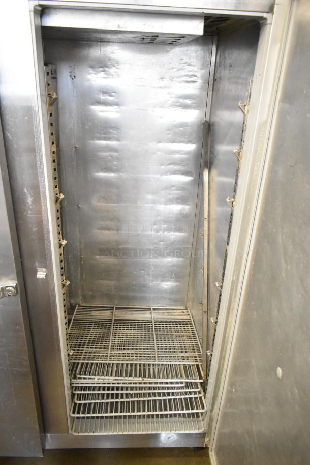 McCall 4-4045 Commercial 2 Door Reach-In Cooler, stainless steel interior, used condition, 115 volts, 1 phase.