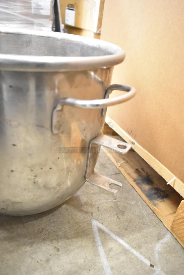 Hobart mixer set with 2 stainless steel mixing bowls and 2 paddle attachments. Some signs of wear. Ideal for baking tasks.