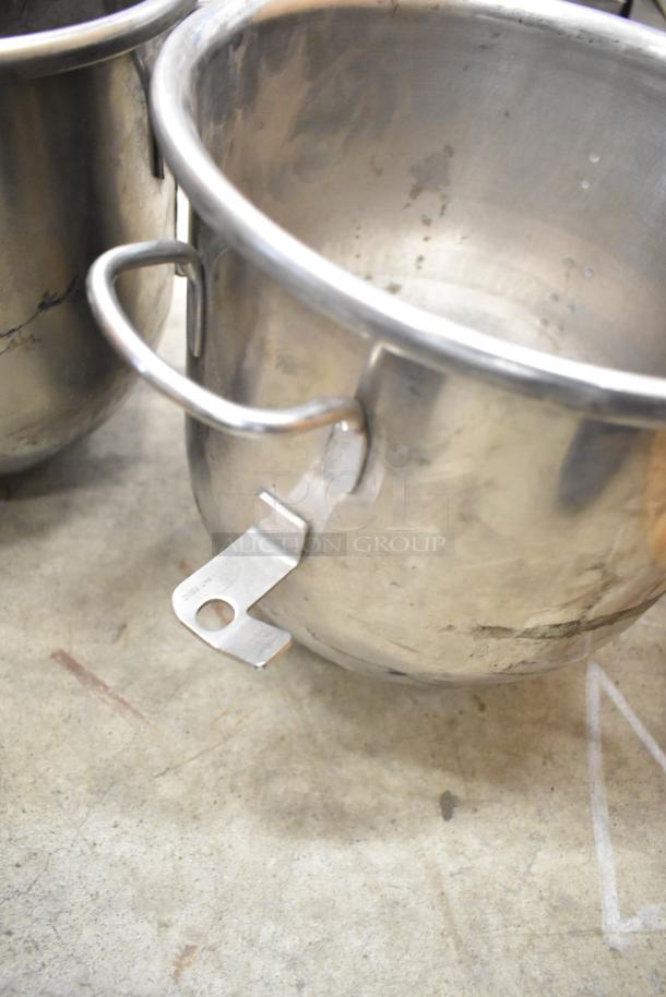 Stainless steel mixing bowl for Hobart mixer, showing handle and attachment latch. Used condition.