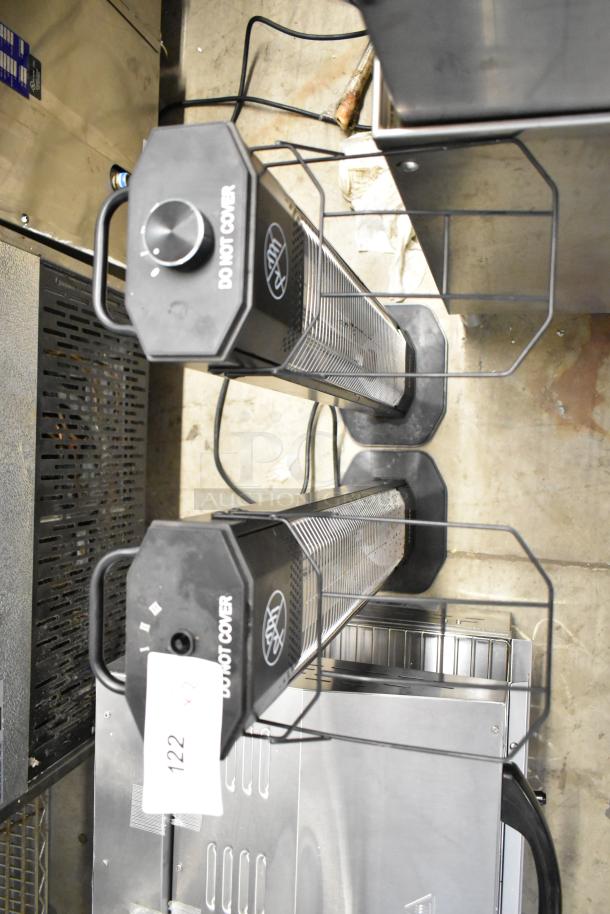 Haimmy UEH520 Infrared Electric Heaters, 120V, 1 Phase, safety cage, labeled "DO NOT COVER," auction tag visible.