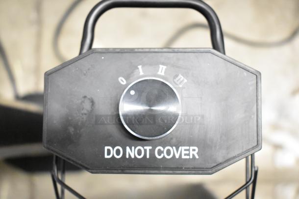 Haimmy UEH520 infrared electric heater dial with power settings. Features "DO NOT COVER" label.