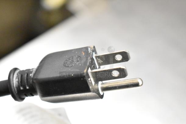 Close-up of a plug for Haimmy UEH520 infrared electric heater, 120 volts, 1 phase.