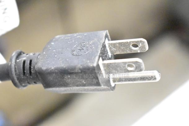 Connector plug of Haimmy UEH520 infrared electric heater, 120V, 1 phase. Close-up view showing prongs and marking.