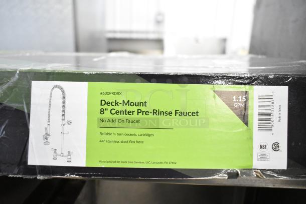 Brand new Regency 600PRD8X pre-rinse faucet with 8" centers, 1.15 GPM, 44" steel hose, visible scratch and dent.