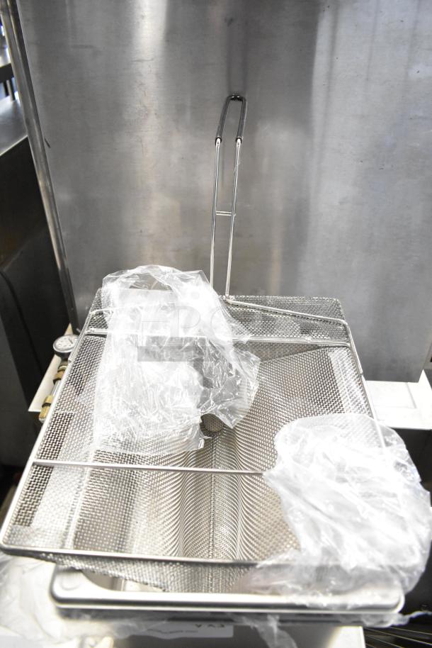 3 Vigor 1/2 size 6" deep anti-jam stainless steel steam table pans, new, 22 gauge, includes sediment tray, wrapped in plastic.