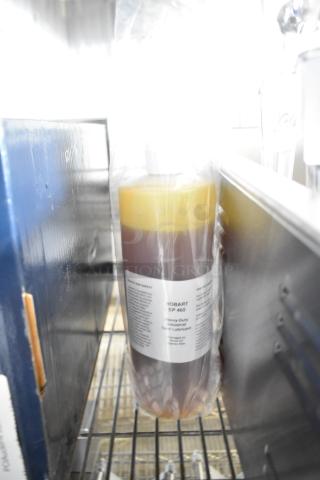 Brand new Hobart 00-102973-00035 Ep 460 lubricant, 28 oz. Scratch and dent condition, labeled as industrial gear lubricant.