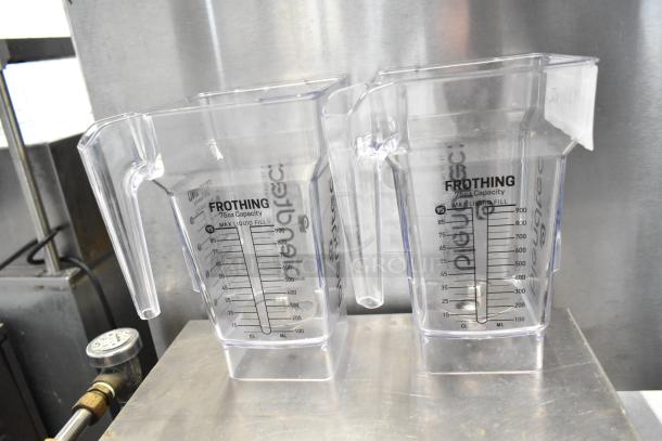 2 Brand New Blendtec FourSide 40-611-60 75 oz. clear frothing jars, no lids, with visible measurement markings.