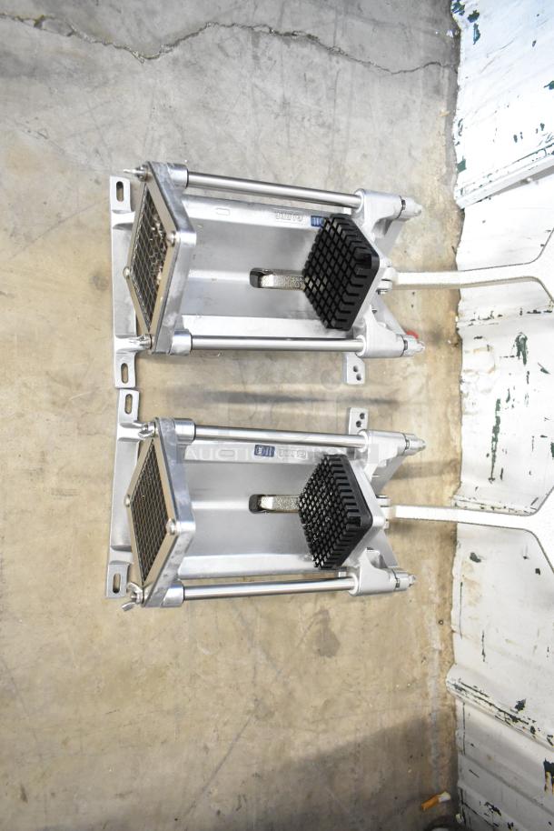 Two brand new Garde heavy-duty French fry cutters, 1/4" FC14 and 3/8" FC38 models, shown on a concrete floor.