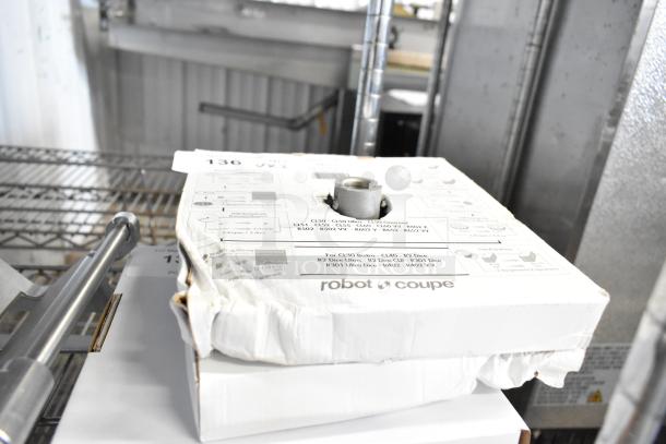 Robot Coupe slicing disc and dicing grid, brand new, slightly dented boxes, models 28132 and 28121, visible label.