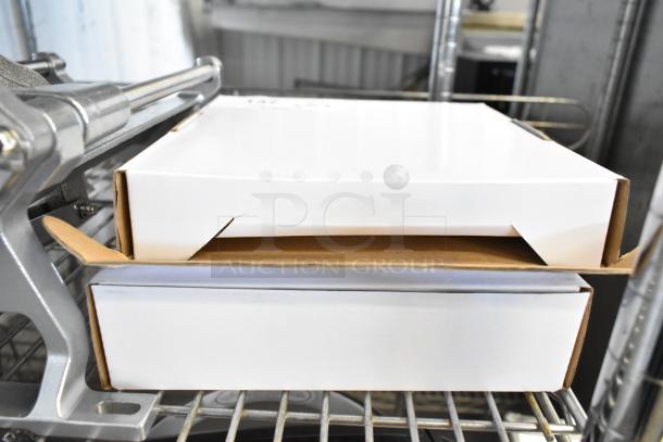 Two boxed AvaMix Goliath replacement parts, unused, include 3/8" dicing grid and 5/32" slicing plate.