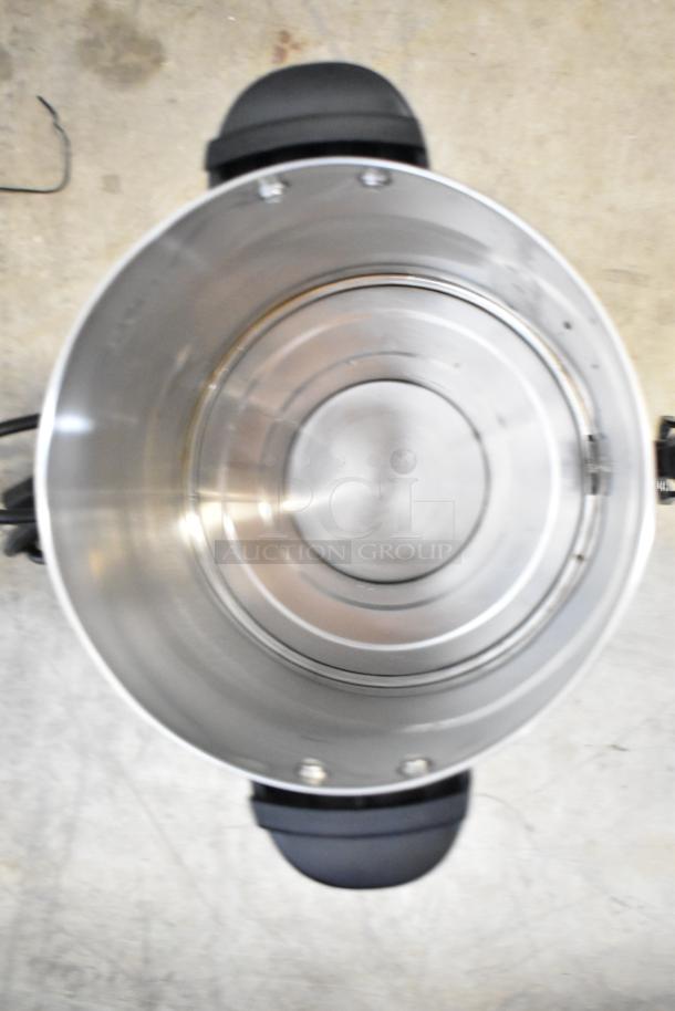 Avantco WB8L 2.1 Gallon Water Boiler interior. Stainless steel, 54 cup capacity, 120V, scratches visible.