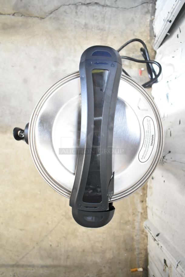 Top view of Avantco WB8L water boiler, stainless steel lid, black handle, new scratch and dent condition, 2.1-gallon capacity.