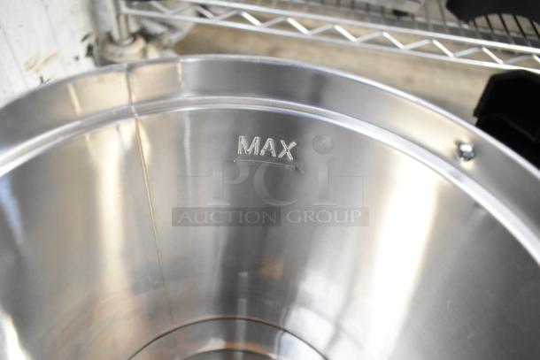 Interior of a stainless steel water boiler, featuring a "MAX" fill line marking.