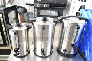 Three Avantco stainless steel beverage appliances including a 45-cup and 65-cup coffee urns, and a 5-gallon water boiler. Brand new.