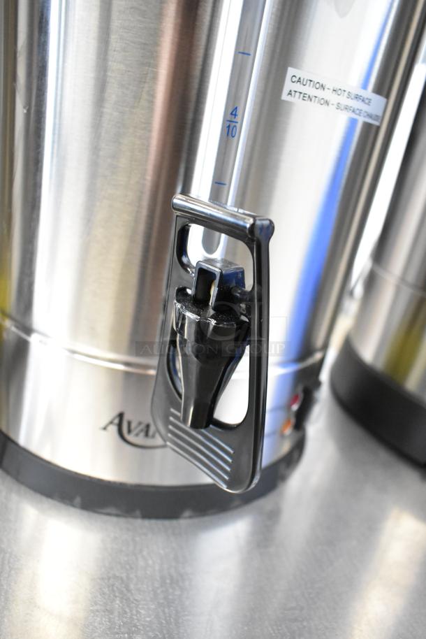 Avantco coffee urn with spigot, stainless steel body, caution label, part of a 3-piece auction set.