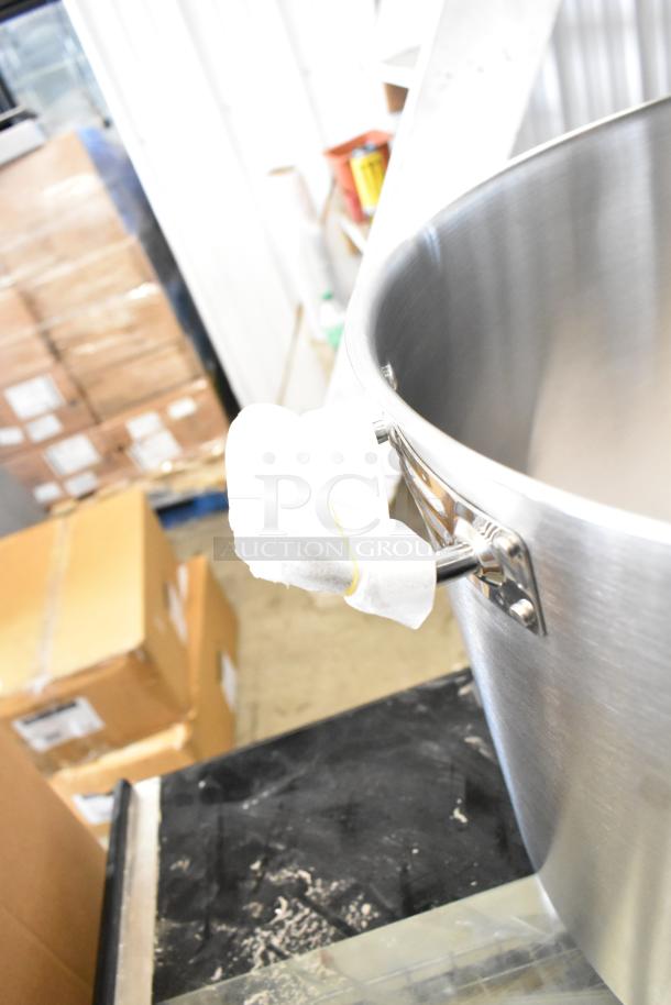 "Vigor SS1 Series 60 Qt. stainless steel stock pot, new scratch and dent, handle wrapped in protective cloth."