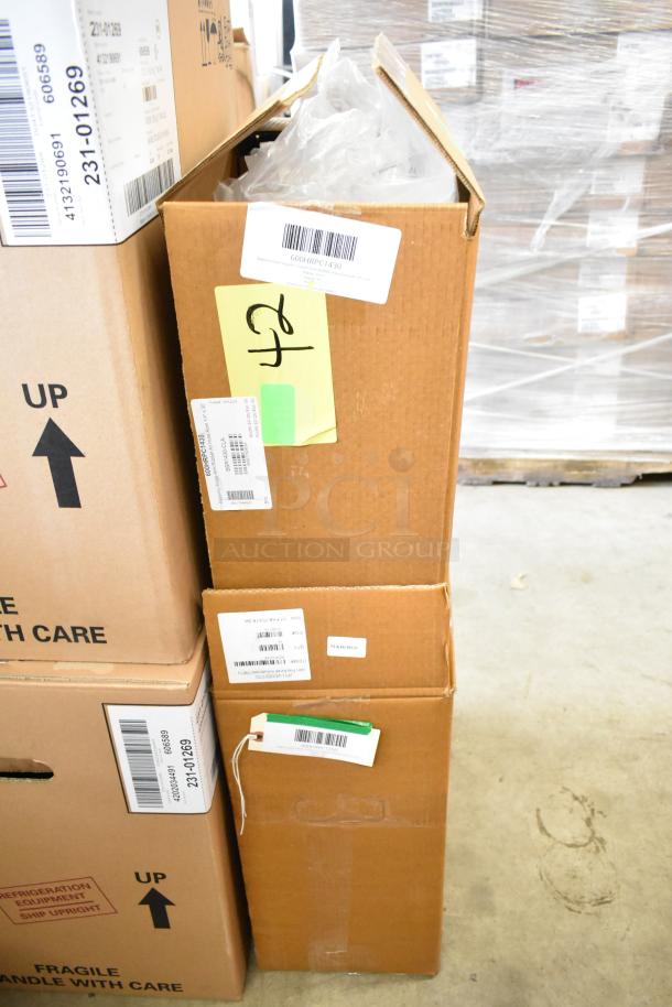 Boxes containing Regency open powder-coated steel air/water hose reels, models 600HRPC1230 and 600HRPC1250, new condition.