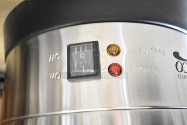 Stainless steel coffee urn with on/off switch, heating indicators, and "Keep Warm" label. Ideal for events.