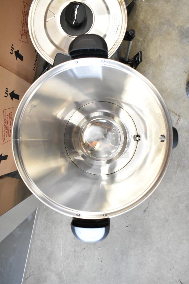 Brand new Avantco WB29L 7.6 Gallon Water Boiler, stainless steel, 120V, 1500W. Inside view showing polish and capacity markings.