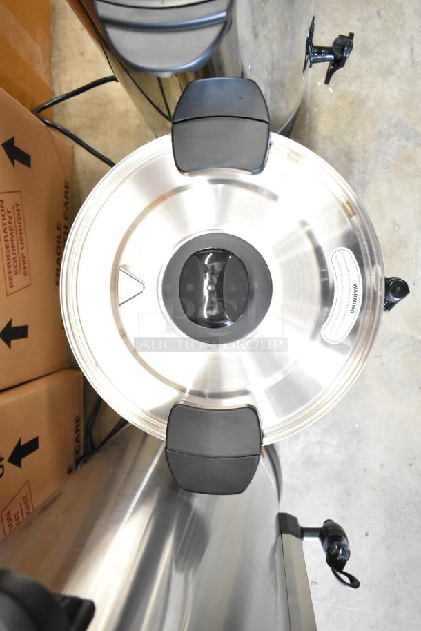 Top view of a new Avantco WB29L water boiler with a stainless steel lid and black handles. Warning label visible.