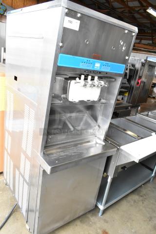 Taylor 8757-33 soft serve ice cream machine, floor style, 2 flavor with twist, 208-230V, 3 phase, stainless steel exterior.