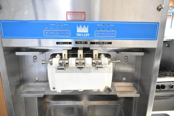 Taylor 8757-33 commercial ice cream machine, 2 flavor with twist, stainless steel, 208-230V, 3 phase, front view.