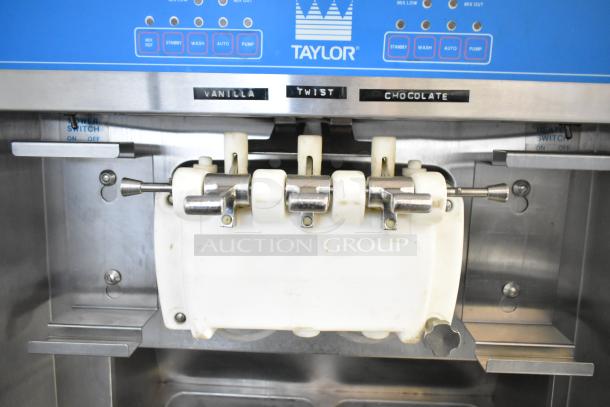 Taylor 8757-33 commercial floor style soft serve ice cream machine with 2 flavors plus twist option. 208-230 Volts, 3 Phase.