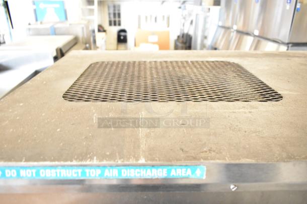 Taylor 8757-33 soft serve ice cream machine, floor style, 2 flavor with twist, 208-230V, 3 phase, caution label visible.