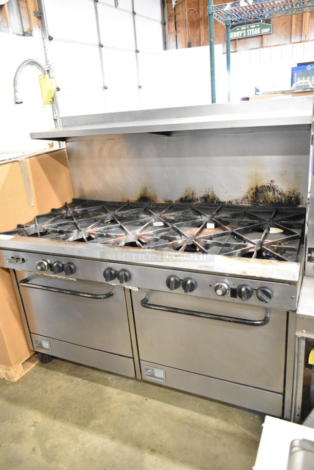 Southbend commercial gas range with 10 burners, 2 ovens, overshelf, and backsplash. Used condition with visible wear.