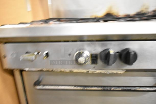 Southbend commercial gas range with 10 burners, 2 ovens, overshelf, and backsplash. Used condition.