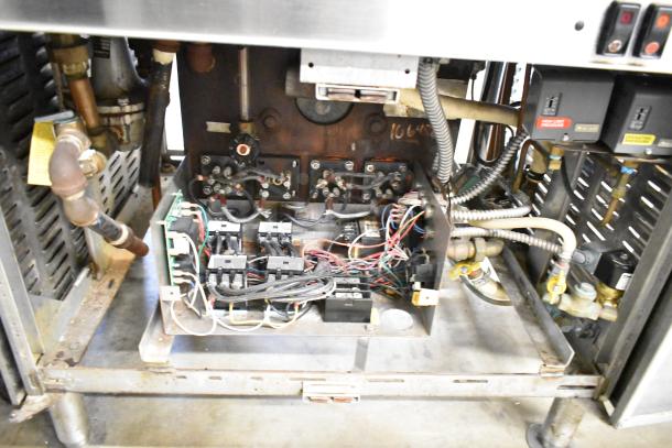 Cleveland Commercial 2 Deck Pressure Steam Cabinet, interior view showing wiring and mechanical components, used condition.